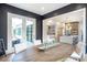 Dining area with large window and open concept views to the kitchen and living room at 12520 Celestine Way, Milton, GA 30075