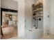 Attractive dog wash station boasts a glass enclosure, shelving, and gray tiling at 12520 Celestine Way, Milton, GA 30075