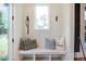 Inviting entryway with a built-in bench, storage cubbies, and stylish decor accents at 12520 Celestine Way, Milton, GA 30075