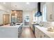 Kitchen boasts a large island with stainless steel appliances and white countertops at 12520 Celestine Way, Milton, GA 30075