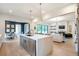 Open concept kitchen and living room with luxury finishes and decor at 12520 Celestine Way, Milton, GA 30075