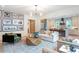 Spacious living room open to the kitchen, featuring stylish decor and ample natural light, perfect for entertaining at 12520 Celestine Way, Milton, GA 30075