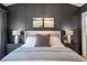 Comfortable main bedroom with a well-dressed bed, side tables with lamps, and artwork at 12520 Celestine Way, Milton, GA 30075