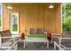 Cozy outdoor patio with comfortable seating and a view of the lush surroundings, ideal for relaxation at 12520 Celestine Way, Milton, GA 30075