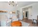 Cozy sitting room with armchairs, leather ottoman, modern lighting and backyard view at 12520 Celestine Way, Milton, GA 30075
