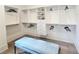 Large walk-in closet featuring custom shelving and storage, with bench seating at 12520 Celestine Way, Milton, GA 30075