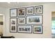 Wall art gallery features the home's exterior and architectural renderings in black frames at 12520 Celestine Way, Milton, GA 30075