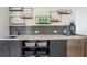 Modern wet bar with sleek cabinets, stylish backsplash, and open shelving, perfect for entertaining guests at 12520 Celestine Way, Milton, GA 30075