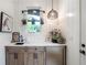 Mud room featuring a wet bar, natural wood cabinets, and stainless mini fridge at 12520 Celestine Way, Milton, GA 30075