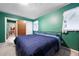 The bedroom showcases soft natural light and calming green walls at 3003 Butler Creek Nw Rd, Kennesaw, GA 30152