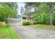 Charming home with a well-maintained lawn and a spacious driveway, perfect for Gathering living at 3003 Butler Creek Nw Rd, Kennesaw, GA 30152
