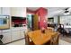Eat-in kitchen with wood table and dining room beyond at 3003 Butler Creek Nw Rd, Kennesaw, GA 30152