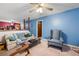 Bright living room with an open layout, featuring a comfortable seating area and a view into the dining space at 3003 Butler Creek Nw Rd, Kennesaw, GA 30152