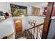 Welcoming staircase with wooden rails, leading to a lower level with stylish decor and lighting at 3003 Butler Creek Nw Rd, Kennesaw, GA 30152
