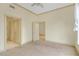 Neutral bedroom with closet and two doorways, featuring carpeted floors and natural light at 3445 Stratford Ne Rd # 305, Atlanta, GA 30326
