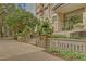 Attractive condominium building exterior with manicured landscaping and clear signage at The Paramount at 3445 Stratford Ne Rd # 305, Atlanta, GA 30326