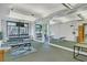 Bright gym featuring weightlifting equipment, mirrors, and a view of the outdoors at 3445 Stratford Ne Rd # 305, Atlanta, GA 30326