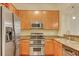 Kitchen features stainless steel appliances, granite countertops, and wood cabinets at 3445 Stratford Ne Rd # 305, Atlanta, GA 30326