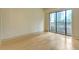 Bright living room with hardwood floors and large glass doors to the balcony at 3445 Stratford Ne Rd # 305, Atlanta, GA 30326