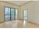 Bright living room with hardwood floors and large glass doors to the balcony at 3445 Stratford Ne Rd # 305, Atlanta, GA 30326