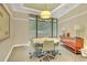 Bright meeting room with a round table, stylish chairs, and a sideboard with lamps at 3445 Stratford Ne Rd # 305, Atlanta, GA 30326