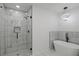 Elegant bathroom featuring a glass-enclosed shower and a modern soaking tub at 3634 Oakleaf Pass, Fairburn, GA 30213