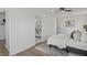 Bedroom with hardwood floors leading to bathroom with modern decor at 3634 Oakleaf Pass, Fairburn, GA 30213