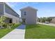 New construction home with a gray exterior and a well-manicured lawn at 3634 Oakleaf Pass, Fairburn, GA 30213