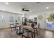 Inviting living room with hardwood floors, a ceiling fan, and an open layout to the kitchen at 3634 Oakleaf Pass, Fairburn, GA 30213