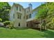 Spacious backyard featuring a covered patio and mature trees at 4058 Vinings Mill Se Trl, Smyrna, GA 30080