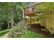 Backyard view featuring a wooden deck surrounded by trees at 4058 Vinings Mill Se Trl, Smyrna, GA 30080