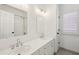 Bathroom featuring a large double vanity, tiled floors, a shower, and bright lighting at 4058 Vinings Mill Se Trl, Smyrna, GA 30080