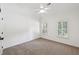 Bright bedroom featuring carpeted floors, two windows, a ceiling fan, and neutral walls at 4058 Vinings Mill Se Trl, Smyrna, GA 30080
