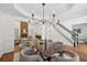 Spacious dining area with hardwood floors leading into a cozy living room at 4058 Vinings Mill Se Trl, Smyrna, GA 30080
