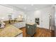 Updated kitchen featuring white cabinets, granite countertops, stainless steel appliances, and a functional kitchen island at 4058 Vinings Mill Se Trl, Smyrna, GA 30080