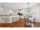 Eat-in kitchen with counter seating, stainless steel appliances, and hardwood floors at 4058 Vinings Mill Se Trl, Smyrna, GA 30080