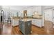 This kitchen features granite countertops, white cabinets, stainless steel appliances, and a stylish kitchen island at 4058 Vinings Mill Se Trl, Smyrna, GA 30080