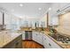 Bright kitchen with granite countertops, white cabinets, stainless steel appliances, and hardwood flooring at 4058 Vinings Mill Se Trl, Smyrna, GA 30080