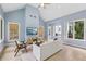 Comfortable living area with vaulted ceiling, bright lighting, and large windows providing wooded views at 4058 Vinings Mill Se Trl, Smyrna, GA 30080