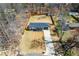 Birds-eye view features a driveway, manicured lawn, and wooden perimeter fence on a well-maintained property at 5109 Dogwood Hills Dr, Sugar Hill, GA 30518