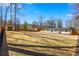 Expansive backyard with a shed and wooden fence surrounding the property at 5109 Dogwood Hills Dr, Sugar Hill, GA 30518