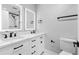 Modern bathroom with double vanity, beautiful mirrors and sleek black fixtures at 5109 Dogwood Hills Dr, Sugar Hill, GA 30518