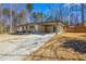 Spacious driveway leading to a cozy home with a convenient carport at 5109 Dogwood Hills Dr, Sugar Hill, GA 30518