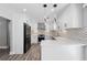 Updated kitchen featuring quartz counters, stainless appliances, and stylish backsplash at 5109 Dogwood Hills Dr, Sugar Hill, GA 30518