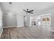Open floor plan living room showing access to the kitchen and outdoor patio at 5109 Dogwood Hills Dr, Sugar Hill, GA 30518