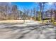Charming home with a long driveway on a tree-lined street at 5109 Dogwood Hills Dr, Sugar Hill, GA 30518