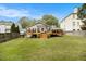 Expansive backyard featuring a deck, lush lawn, and mature landscaping, perfect for outdoor activities at 3013 Surrey Ln, Atlanta, GA 30341
