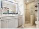 Modern bathroom with a double vanity, frameless glass shower, and stylish fixtures at 3013 Surrey Ln, Atlanta, GA 30341