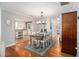 Charming dining room with hardwood floors, chandelier, and adjacent kitchen access at 3013 Surrey Ln, Atlanta, GA 30341