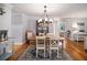 Inviting dining room featuring wood floors, elegant lighting, and stylish decor at 3013 Surrey Ln, Atlanta, GA 30341